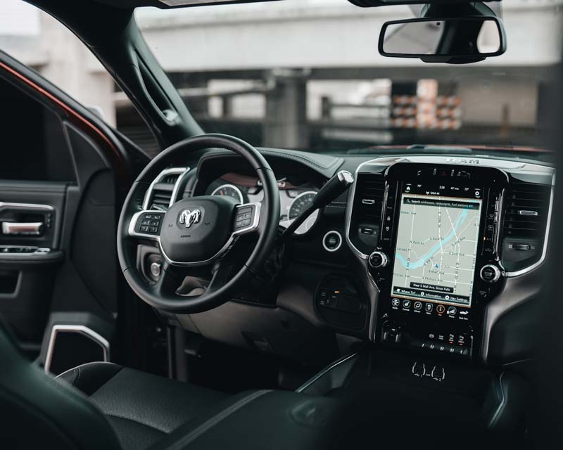Interior of a Dodge Ram truck with a touch-screen navigation system