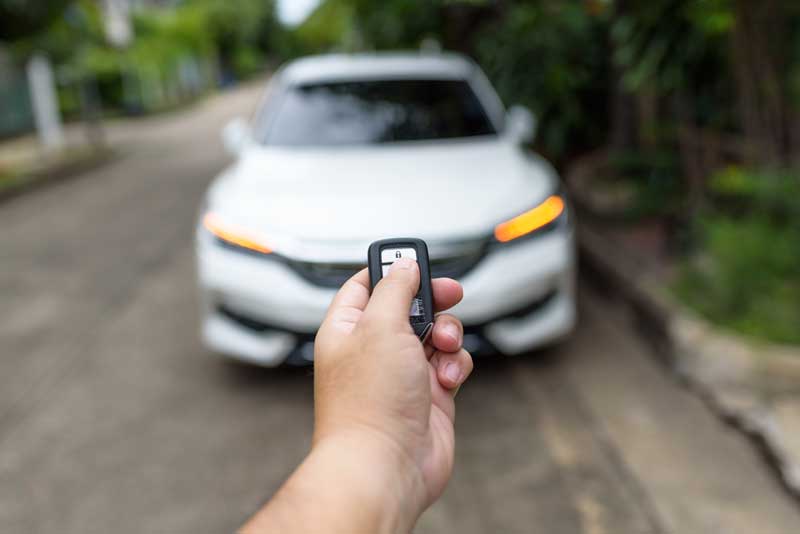 Remote starter in front of a white car